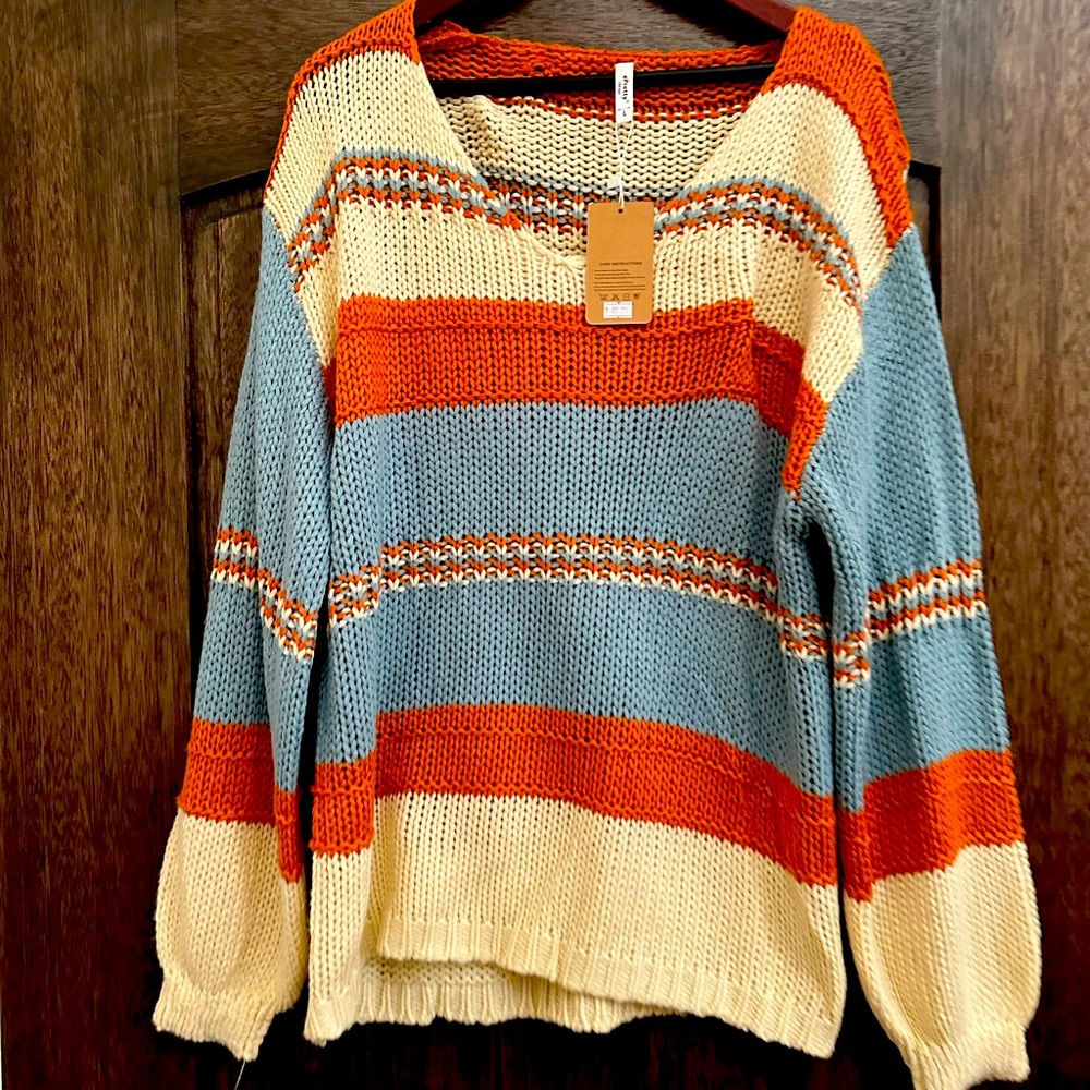 Oversized sweater never worn. Beautiful colors. Bought at a boutique in Rockport
